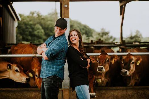 Chris & Erika Appel's engagement photo with the cows. 